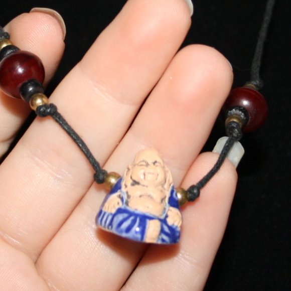 Nwot leather necklace with red beads and Buddah